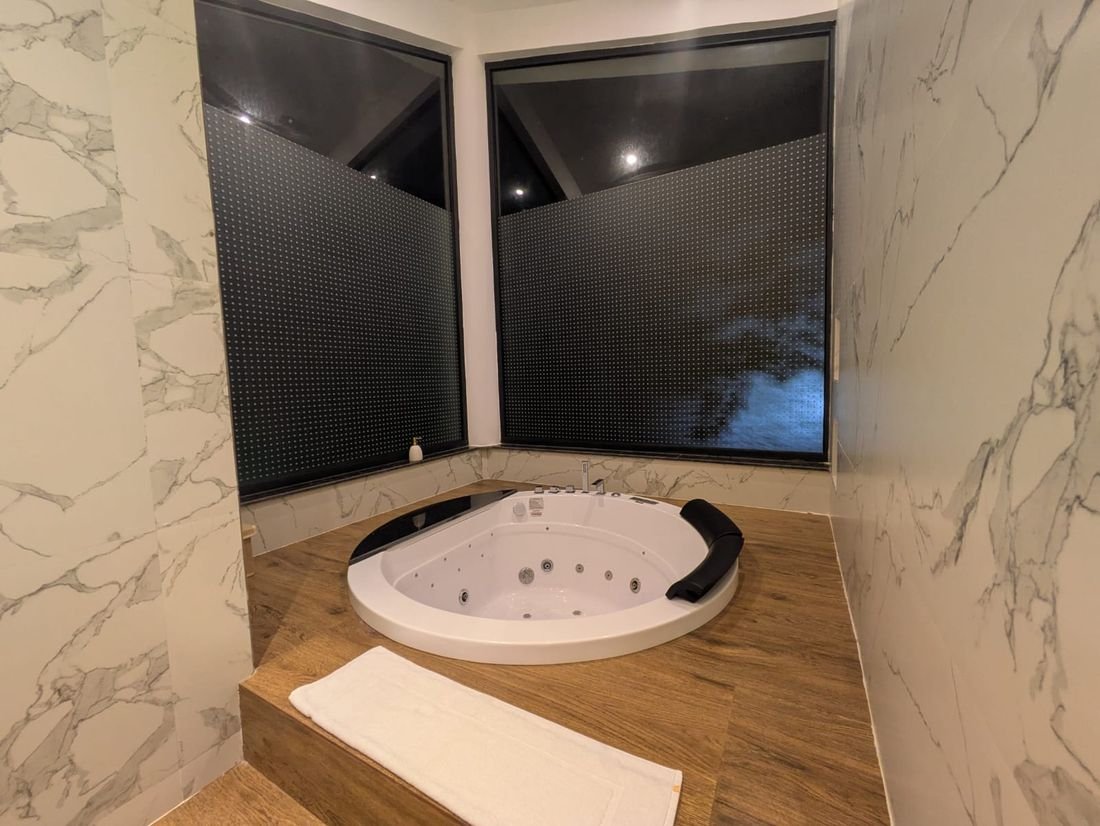 A marble en-suite bathroom at Palmwood Hills — 7